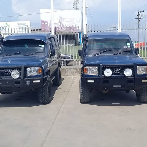 Two Toyota LandCruiser vehicles published by CNU Hire Cars Ltd